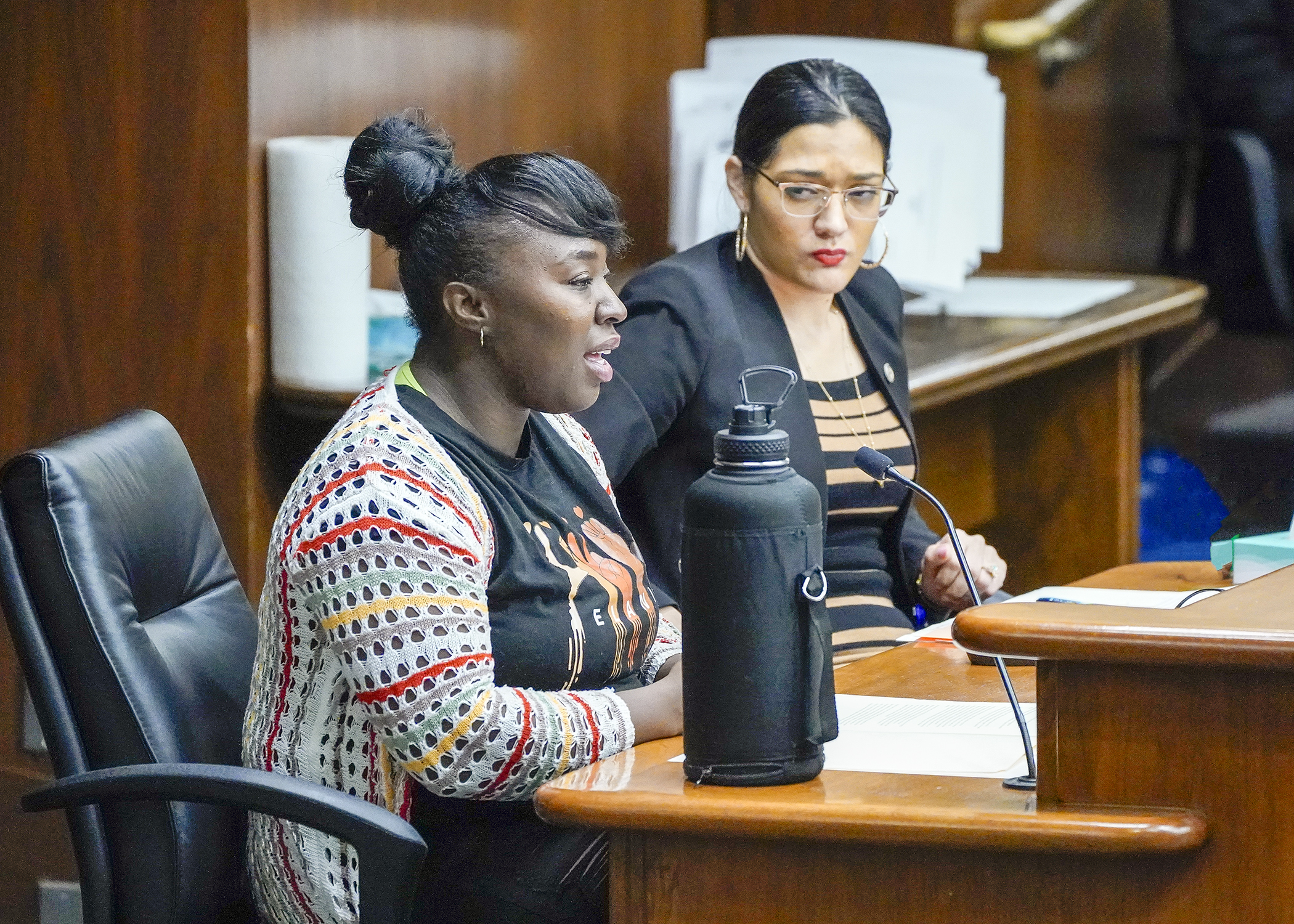 Marion Butler testifies before the House Housing Finance and Policy Committee Feb. 21 in support of a bill sponsored by Rep. Marìa Isa Pèrez-Vega, right, that would provide tenants the right to organize. (Photo by Andrew VonBank)